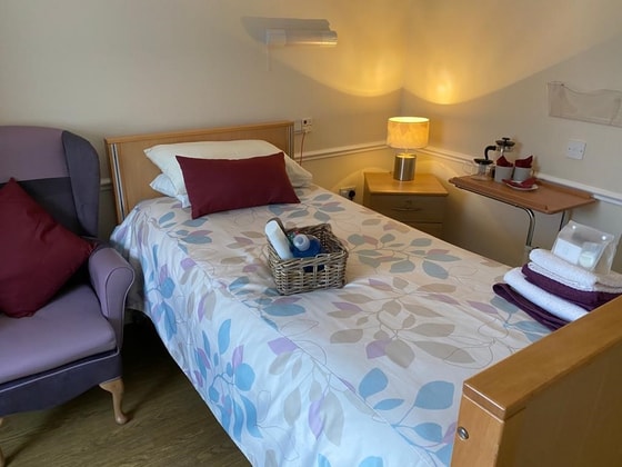 Single bed with orange light