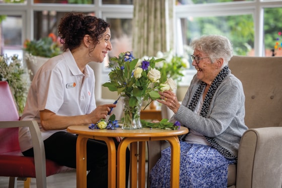 Living room, seat, table, flowers, support worker