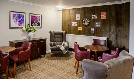 Darts board and armchair