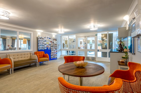 Orange seating blue wall