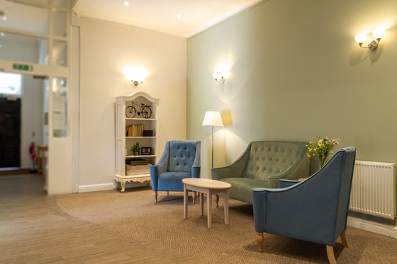 Sitting area, sofa, armchairs, bookshelf, modern