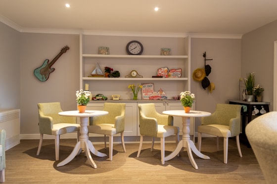 Dining area, tables, shelf, guitar, flowers
