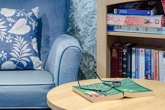 book and glasses on table