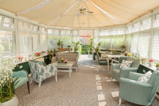 Green and white conservatory  