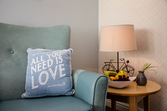 Love cushion on arm chair