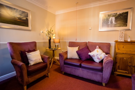 Purple sofas and white walls