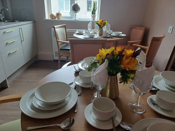 Dining table with pink chairs