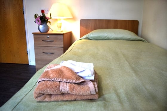 Fazakerley House Care Home - Green Bed Brown towel
