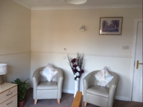Magna Care Home - White chairs and photo 