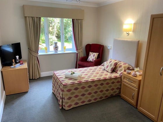 Sutherland Court Care Home - Dotted Bed and television 