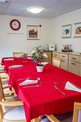 Springwater Lodge Care Home - Red table cloth dining area close up