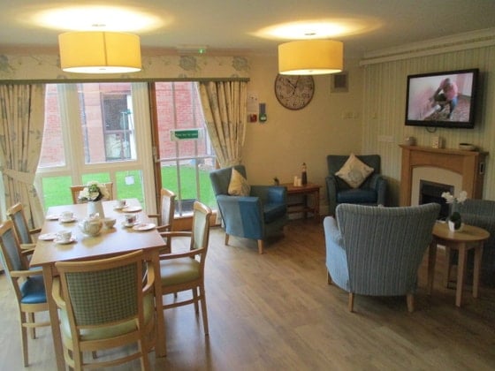 Woodside Court  - Wooden seating with arm chairs 