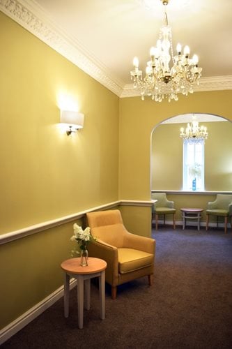 Pendleton Court Care Home - Yellow walls and white chair