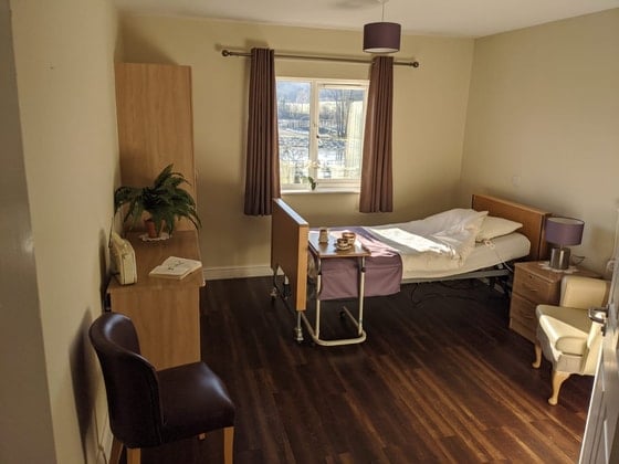 Trafalgar Park Care Home - Single bed with purple curtains