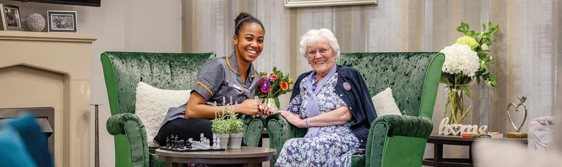 Lime trees care home with resident in green chairs