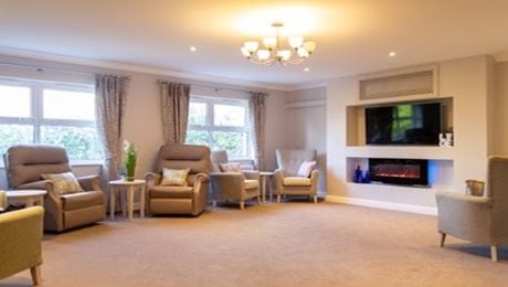 Quarry Hall Care Home - Living area, armchairs, tv