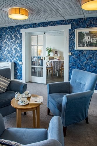 Springwater Lodge Care Home - Blue communal sitting area