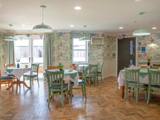 Rivendell View Care Home - Green wooden chair seating