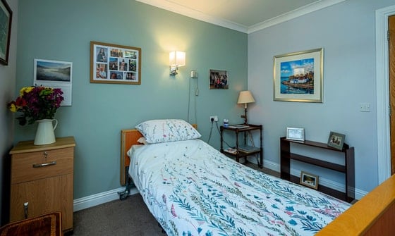 Linlithgow Care Home - Single bed with teal wall