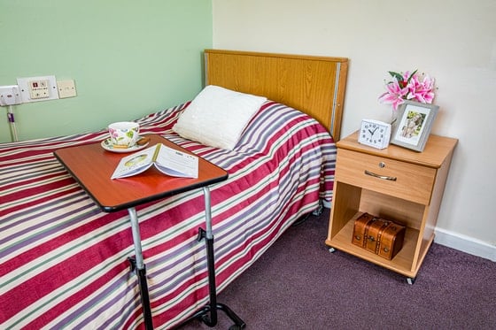 Springwater Lodge Care Home - Single bed red stripes