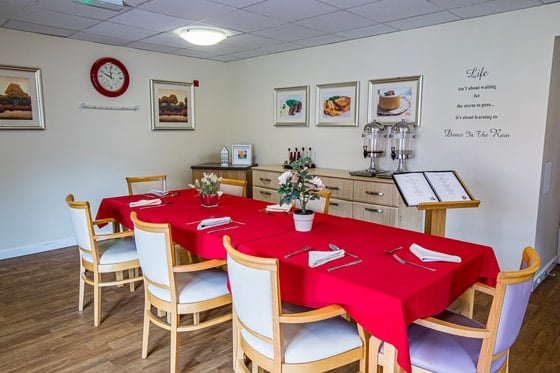Springwater Lodge Care Home - Red table cloth dining area