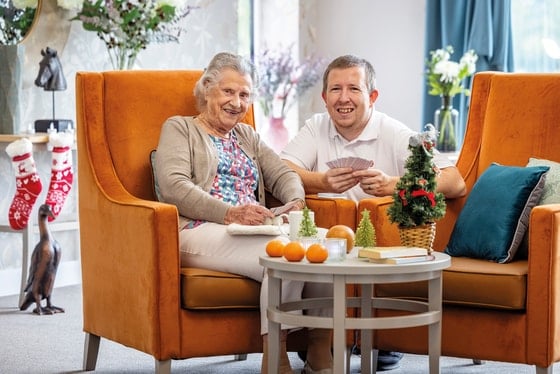 Dovedale Court Care Home - 2 people sat on orange chairs