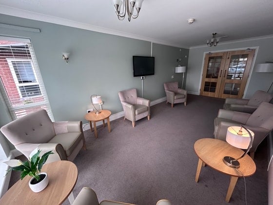 Needham Court Care Home - Senior Living brown lounge