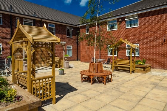 Yew Trees Care Home - Wooden outdoor garden