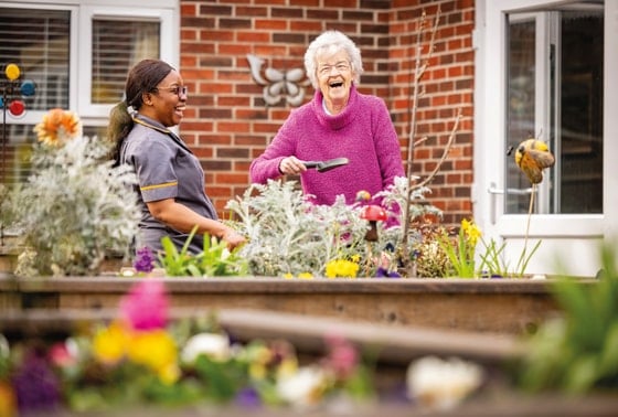 Westleigh Lodge Care Home - Smiling gardening task