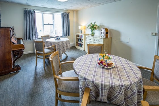 Springwater Lodge Care Home - Small floral tables and piano