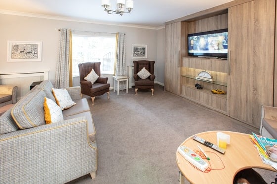 Elmwood House Care Home - Wooden seating with television