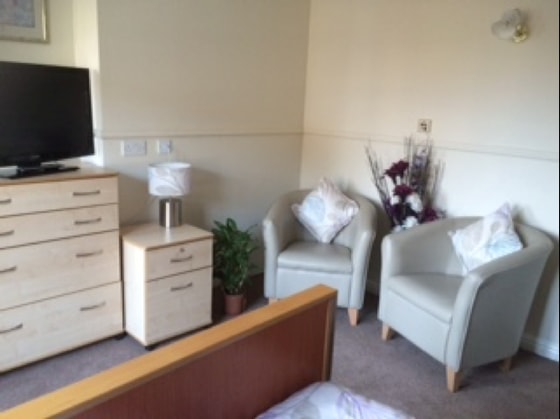 Magna Care Home - White chairs and Television