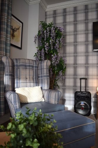 Averill House Care Home - Speaker and checkered wallpaper