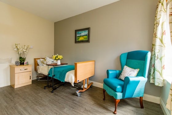 Market Lavington Care Home - Blue armchair with bed
