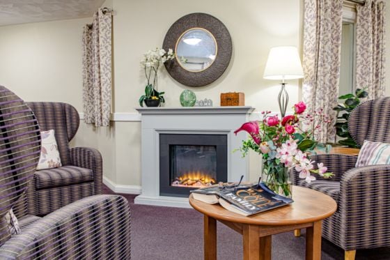 Aberpennar Court Care Home - board games room with green chair