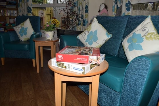 Aberpennar Court Care Home - board games room with green chair