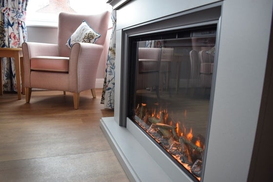 Leighton Court Care Home - Fireplace and purple chairs