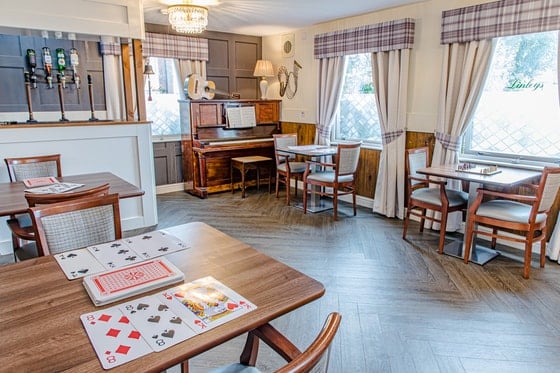 Silverwood Care Home - Silverwood Care Home dining area with a piano