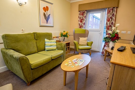 Hodge Hill Grange Care Home - Senior living green arm chair