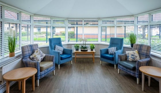 Ailsa Craig Care Home - Blue seating in conservatory 