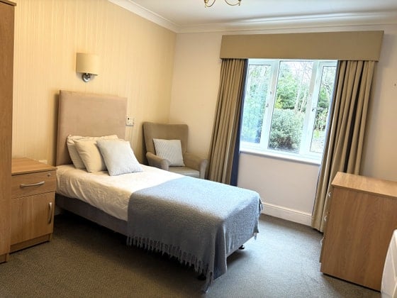 Sutherland Court Care Home - Blue covered double bed