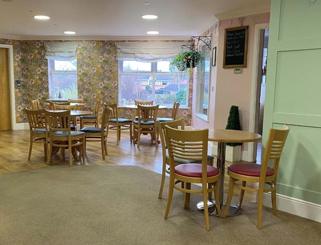 Ebor Court Care Home - Care home dining room with wooden tables and chairs