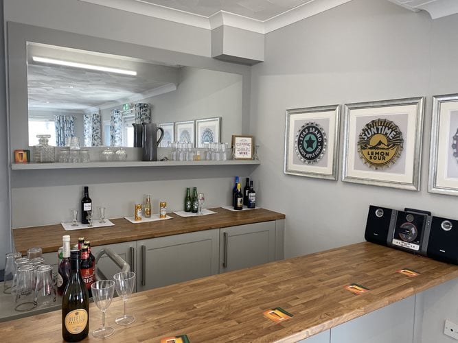 Plas Cwm Carw Care Home - Plas Cwm Carw kitchen area with wine