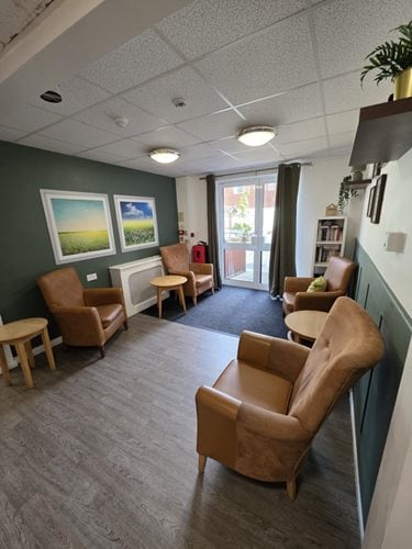 Yew Trees Care Home - Brown chairs corridor
