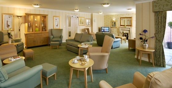 Roby House Care Home - Senior living green seating 