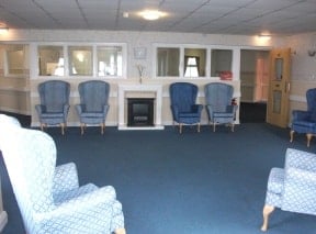 Falstone Manor Care Home - Blue carpet and arm chairs
