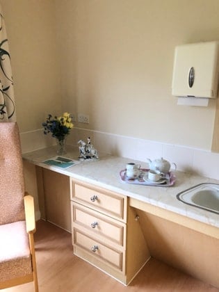 Dove Court Care Home - Counter space with flowers