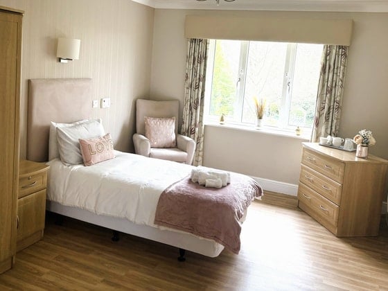Kirkwood Court Care Home - care home pink bed with white covers
