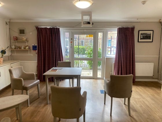 River Court Care Home - Senior living red curtain