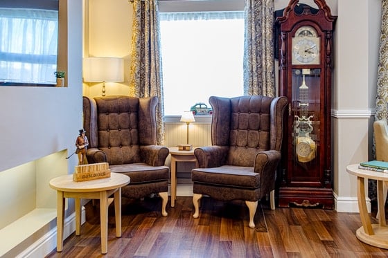 St Martin's Court Care Home - Grandfathers clock with two seats